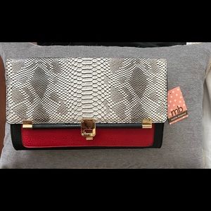Classy leather clutch by Melie Bianco (NWT)